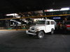 Toyota FJ40 unloading raw coffee at the mill