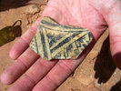 Cubbie found an excellent black-on-white sherd as we attempted to find an easy way down to Duck Head Panel. photo of comment